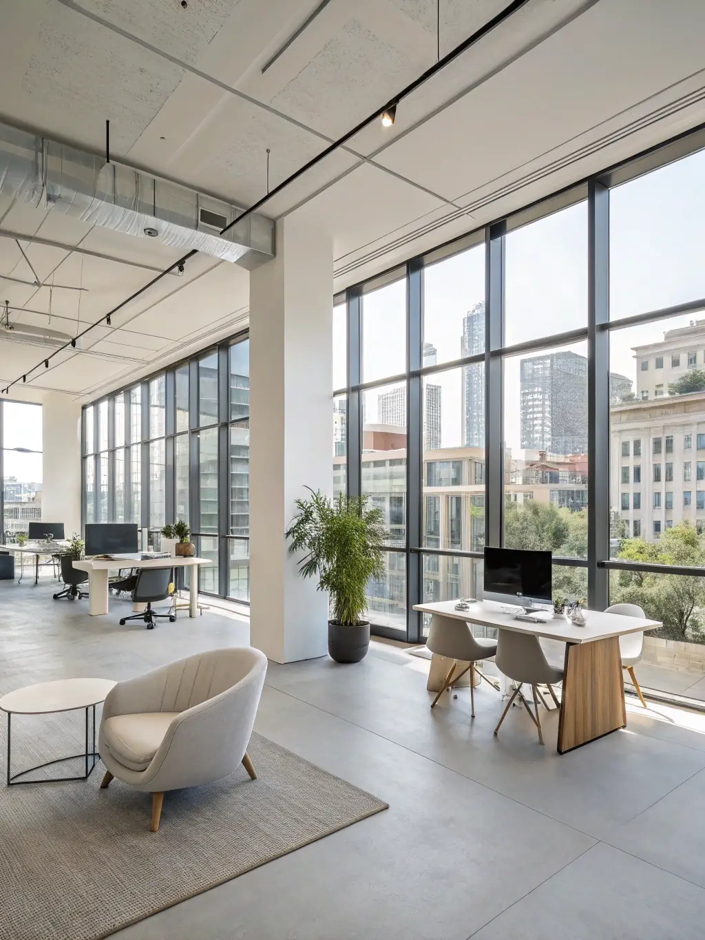 A bright, newly renovated office interior featuring glass partitions, ergonomic furniture, and contemporary lighting, illustrating successful renovation work.